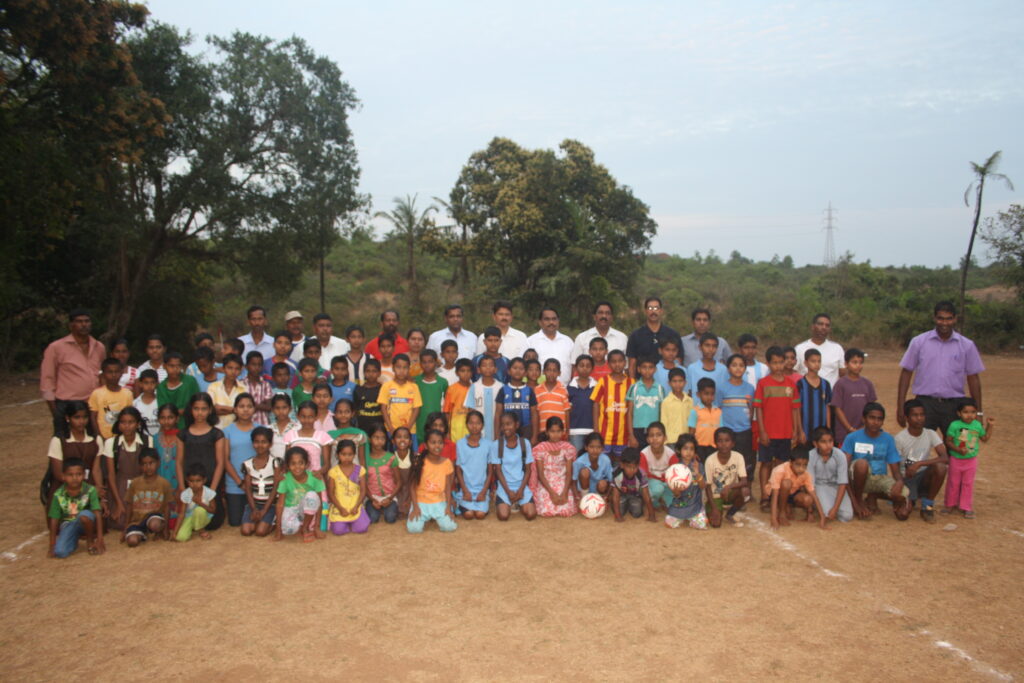 Group photograph of trainees and officials on the ground at the launch of a GFDC centre.