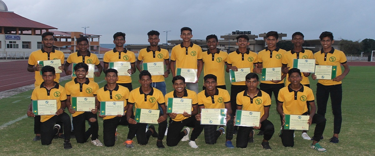 GFDC residential academy graduates pose with their trophy after a tournament win.